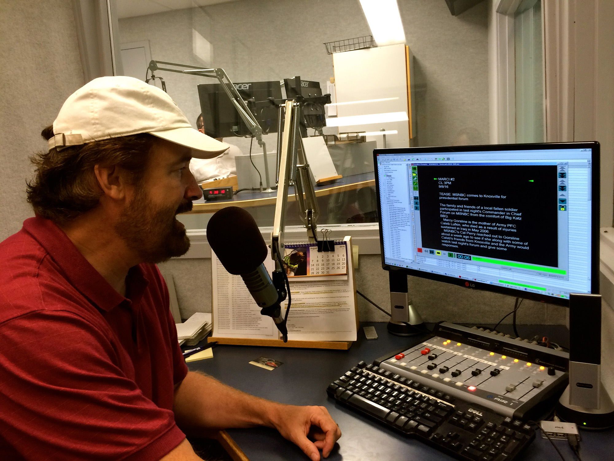 Giving the latest news at WGIL-Radio in Galesburg