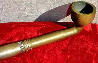 small bowl pipe on red satin fabric